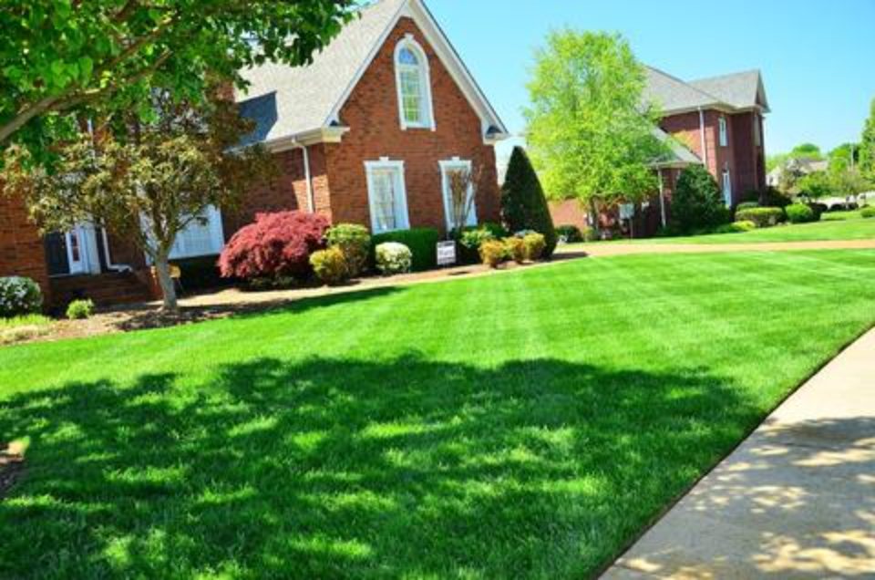 Brick house with green grass