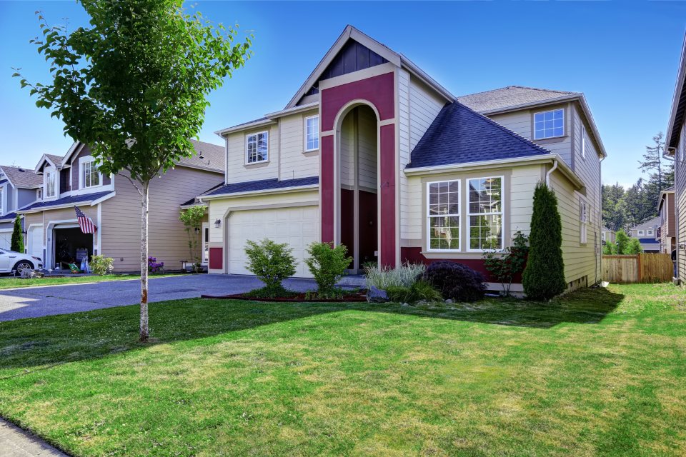 Home with manicured yard